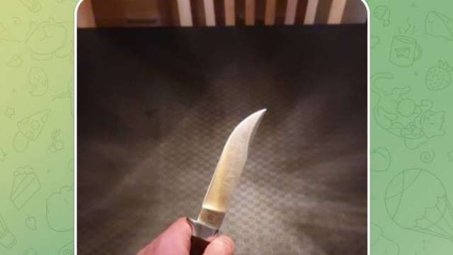 A.L. shows off his knife, which is engraved with a Star of David. A.L. shows off his knife, which is engraved with a Star of David.