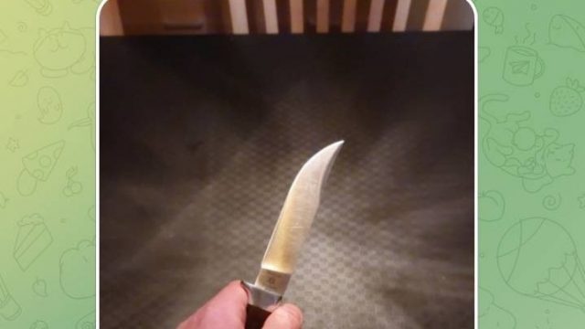 A.L. shows off his knife, which is engraved with a Star of David. A.L. shows off his knife, which is engraved with a Star of David.